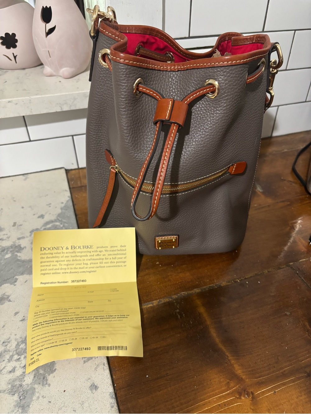 Dooney & Bourke Gray Pebbled Leather Drawstring Bucket Bag with Brown Trim - Picture 6 of 6